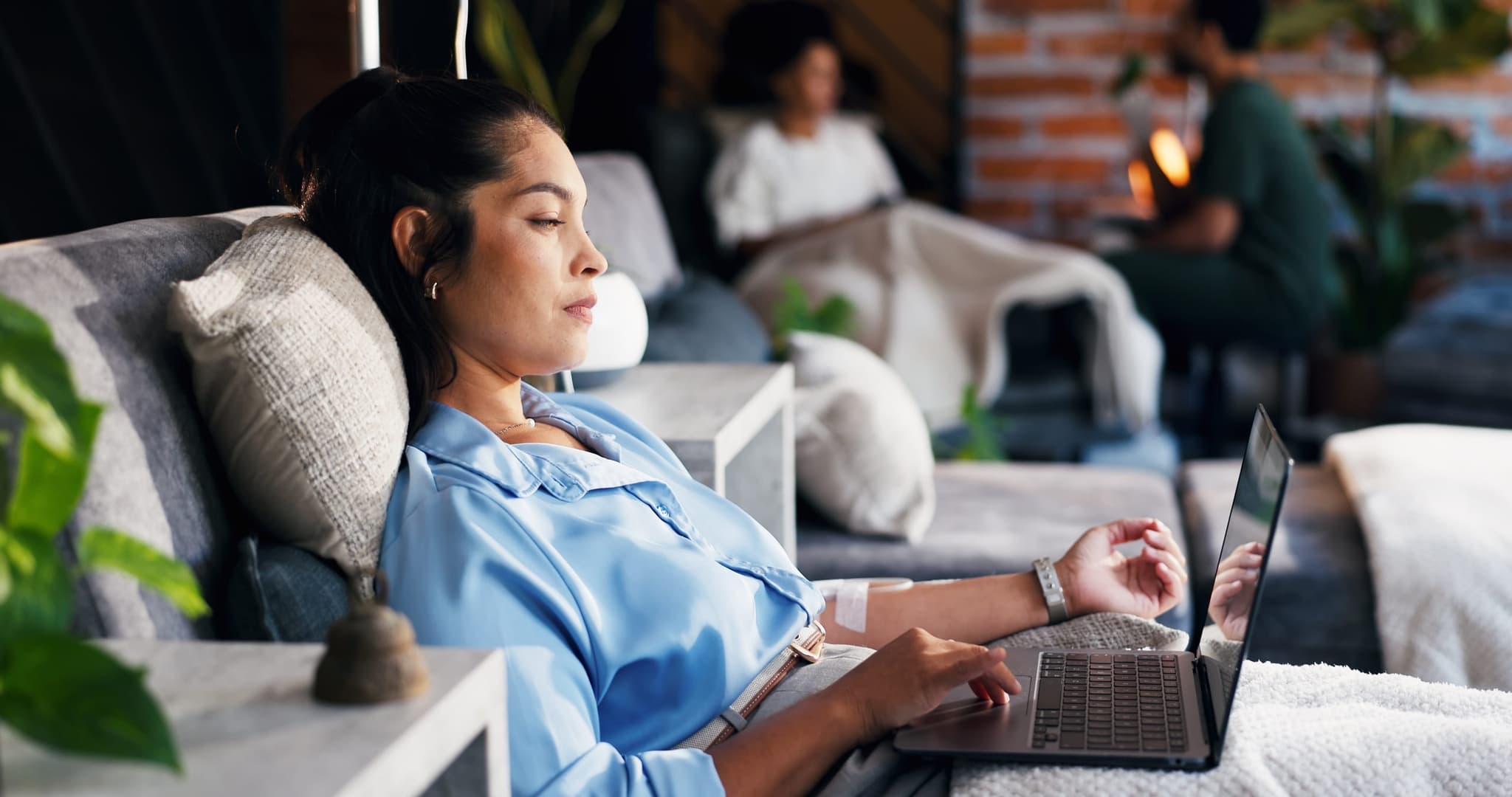 A patient comfortably receiving dialysis treatment in a modern care suite